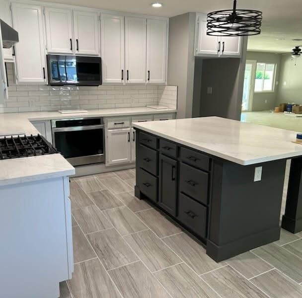 White cabinets & charcoal island — Roseville
