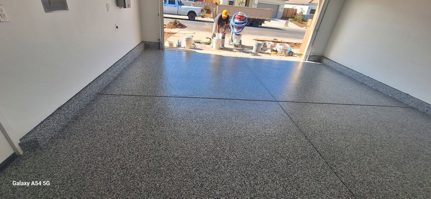 Dark epoxy floor with truck parked