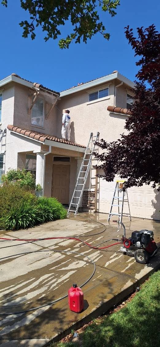 Pressure washing and prep before an exterior repaint